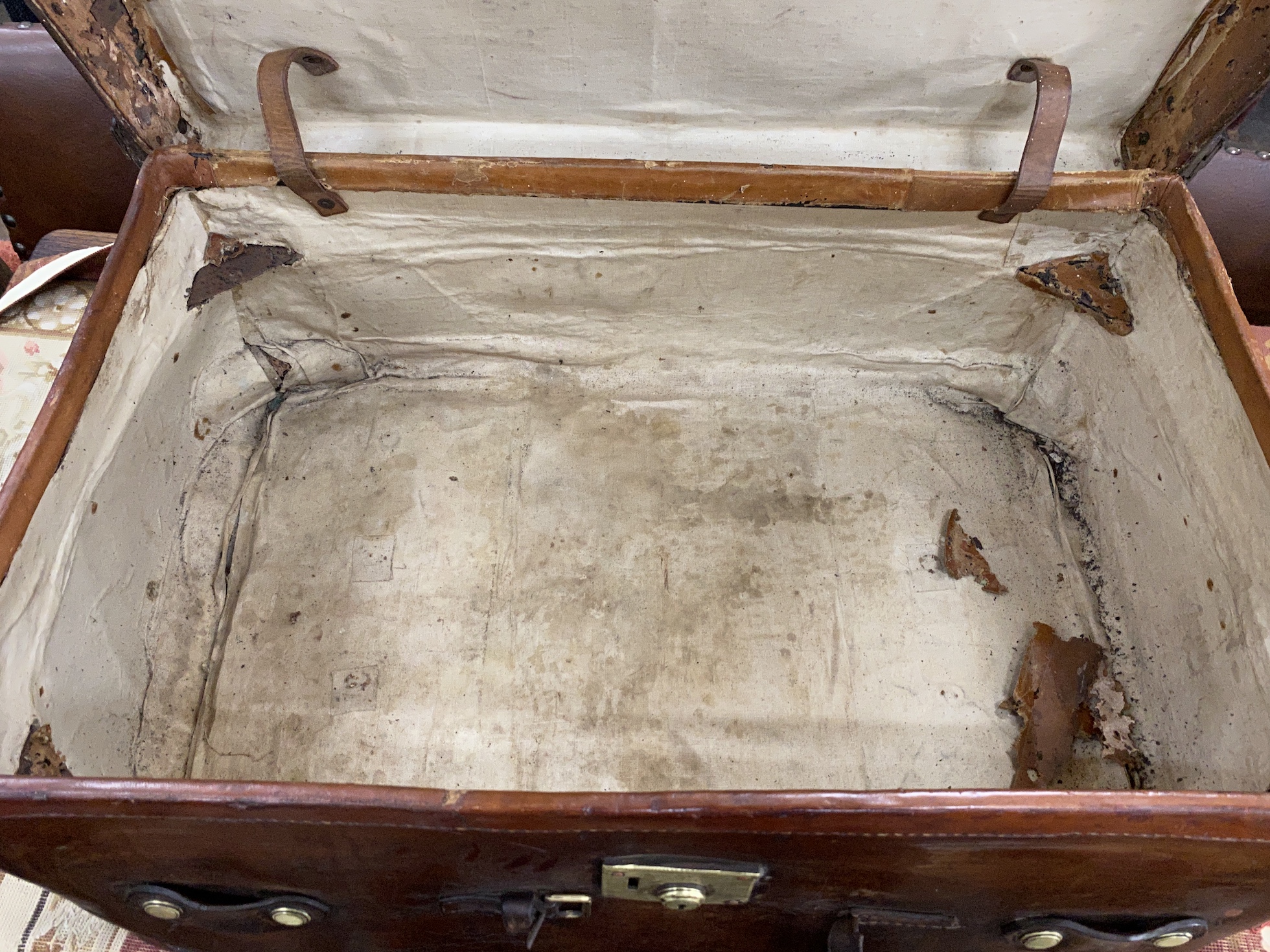 A Victorian leather brass and copper studded travelling trunk, width 89cm, depth 53cm, height 37cm
